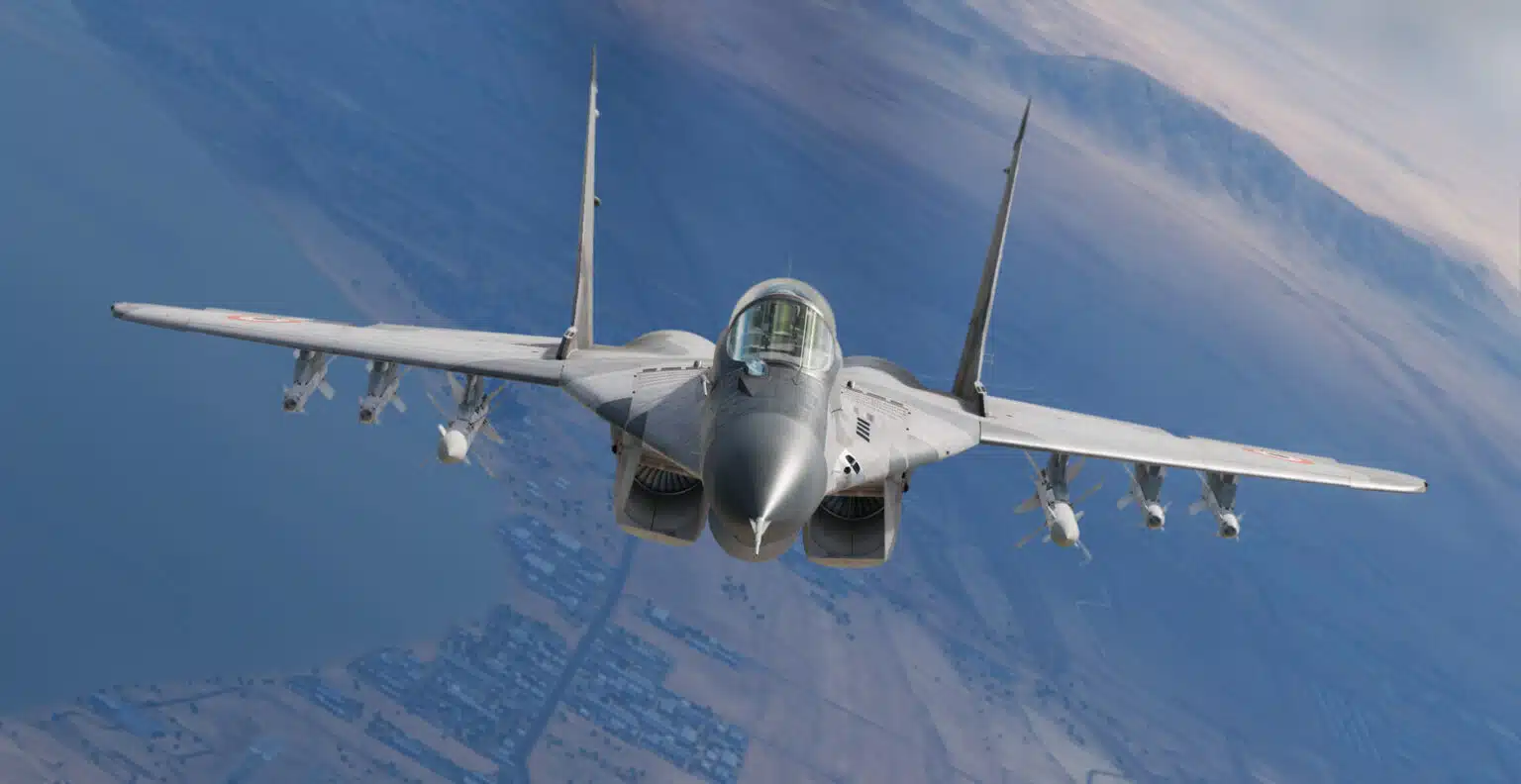 A fighter aircraft banking over the landscape in DCS World