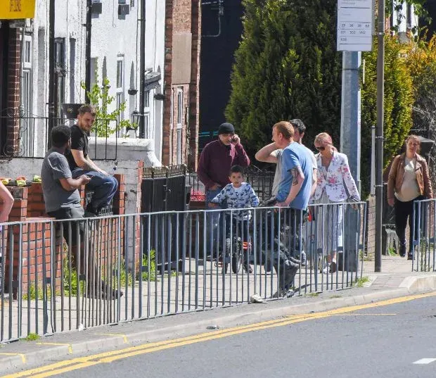 Groups gathered in a Salford street