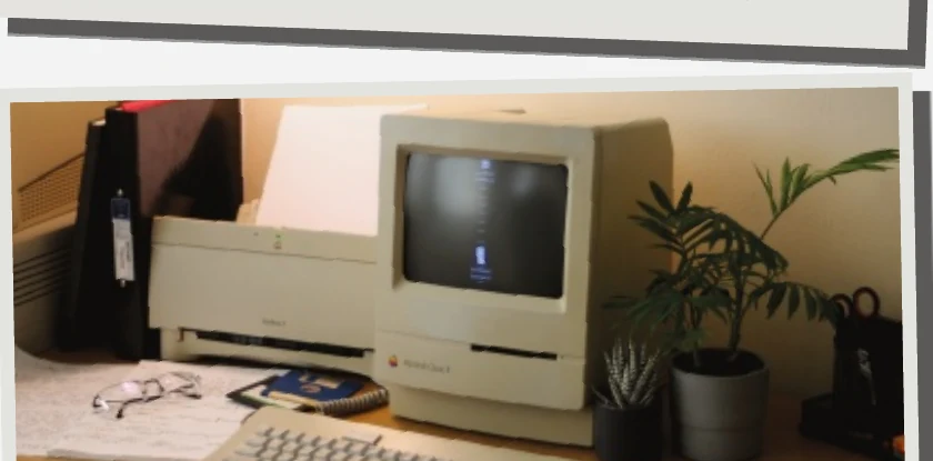 A classic Macintosh computer on a desk