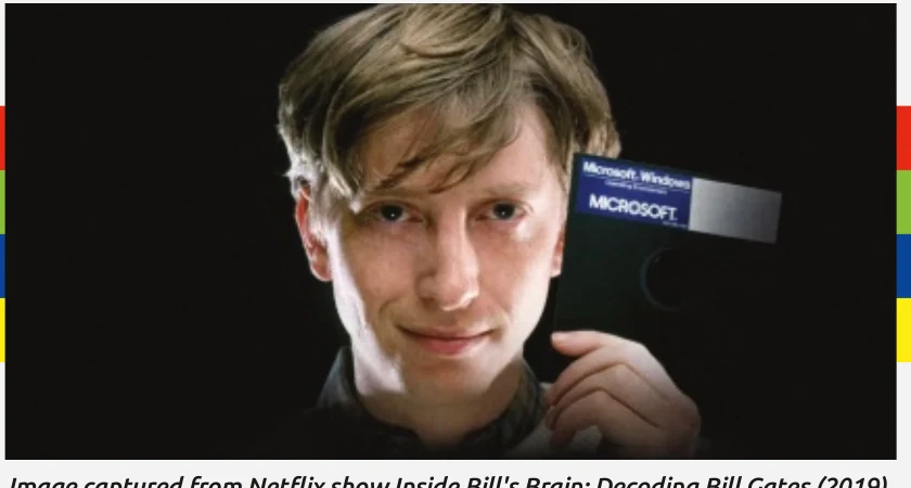 A young Bill Gates holding a Microsoft Windows box
