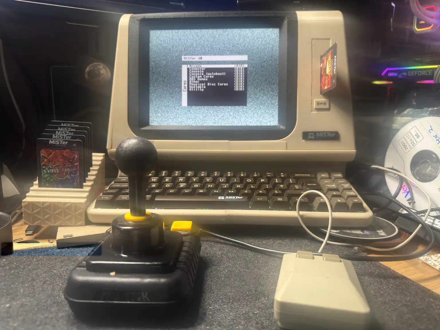 A custom MiSTer FPGA system built into a beige DEC-inspired terminal with keyboard, joystick and mouse