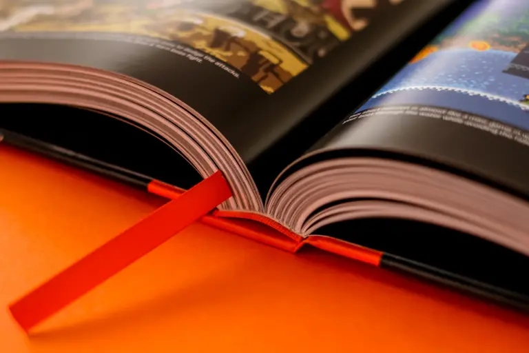 A close view of a premium Bitmap Books hardback, its binding and ribbon marker