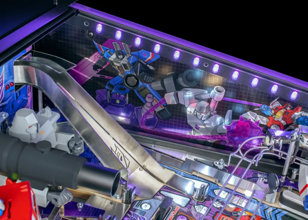 Megatron, Starscream and other Transformers figures mounted across the pinball playfield