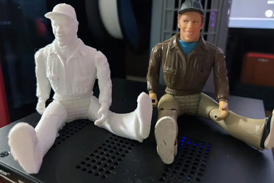 A white 3D print beside the original Murdock figurine