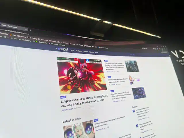 The BenQ ScreenBar Halo 2 lighting a monitor in use