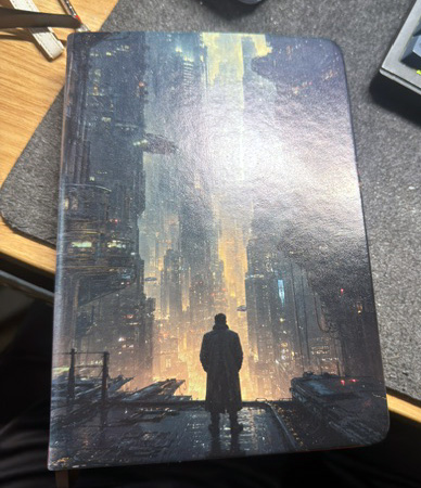 A notebook cover UV printed with a Cyberpunk city scene